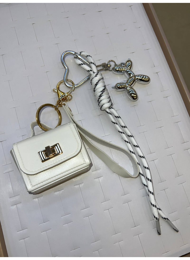 A stylish heart-shaped bag and keychains in assorted colors - Image 1